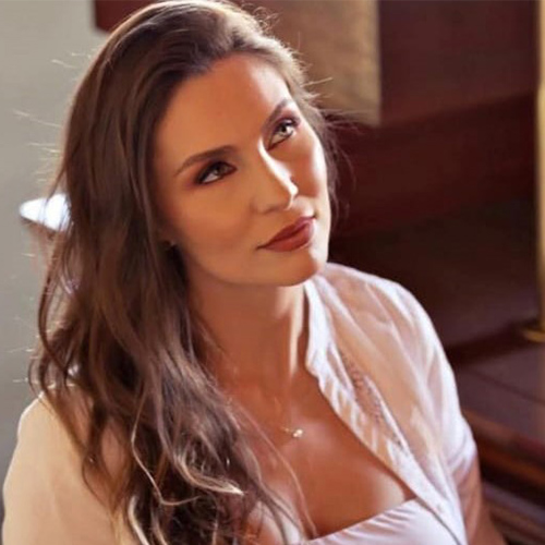 Dra. FLÁVIA FERNANDES PORTELA